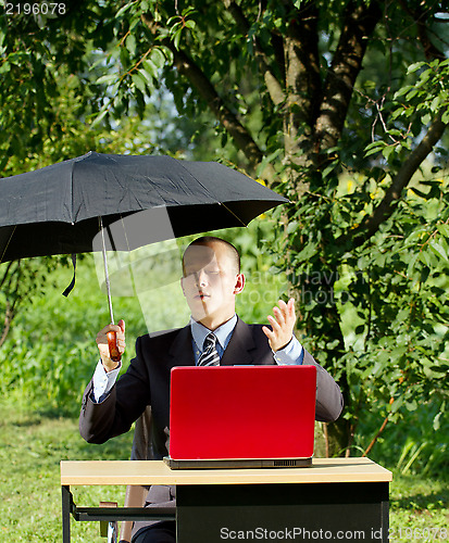 Image of Businessman Working Outdoors