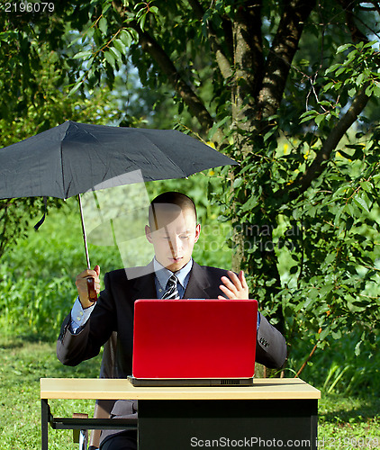 Image of Businessman Working Outdoors