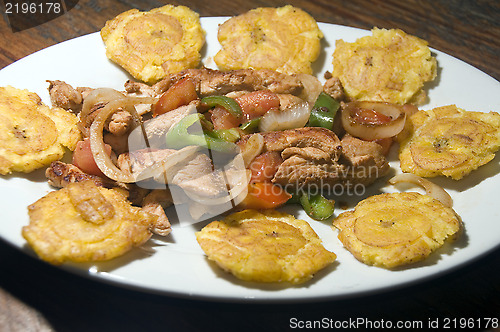 Image of grilled chicken fajita food with local tostones fried plantains 