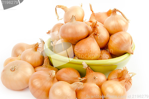 Image of A bowl full of onions on white background