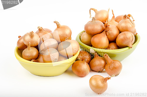 Image of Two bowls full of onions on a white background
