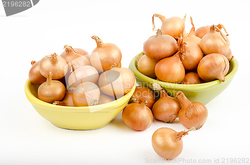 Image of Two bowls full of onions on a white background