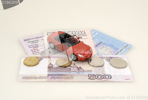 Image of Toy car, money and documents