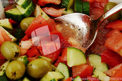 Image of fresh summery salad of fresh olives and tomatos