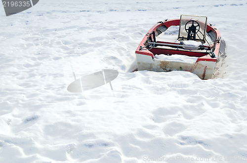 Image of boat in the winter on shore