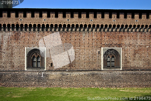 Image of   brick and window in the grass  