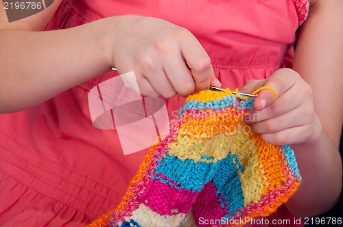 Image of little girl knitting