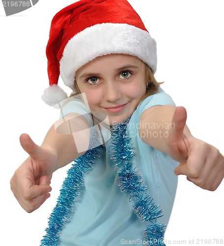 Image of child wearing a Santa hat with thumbs up