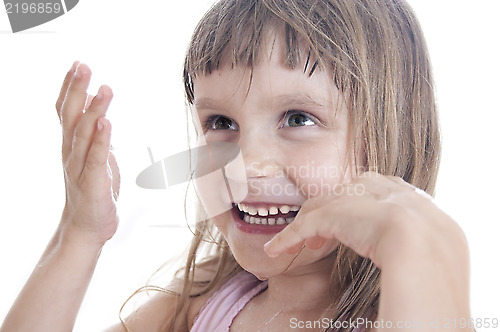 Image of playful child with wet face