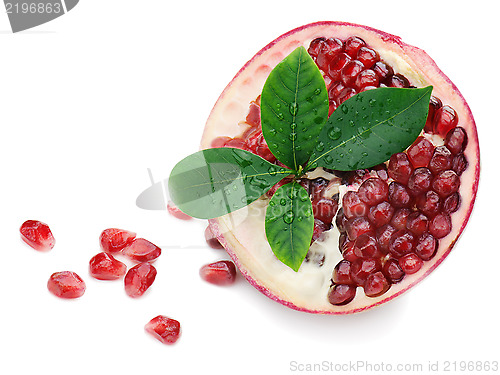 Image of Pomegranate fruit with green leaves isolated on white background