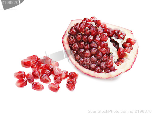 Image of Part of pomegranate fruit isolated on white background. Closeup.