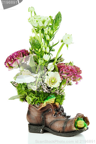 Image of Flower bouquet arrangement centerpiece in old shoe with frogs is