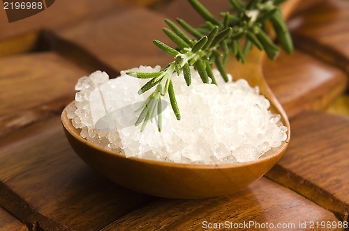 Image of sea salt with rosemary on a wooden spoon