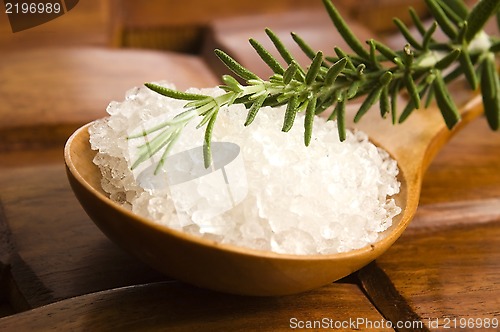 Image of sea salt with rosemary on a wooden spoon