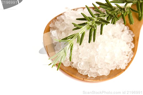 Image of sea salt with rosemary on a wooden spoon