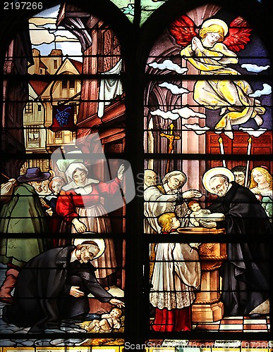 Image of Saint Vincent de Paul raising a newborn and christening