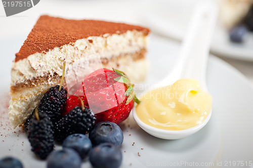 Image of tiramisu dessert with berries and cream