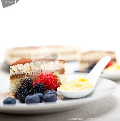 Image of tiramisu dessert with berries and cream