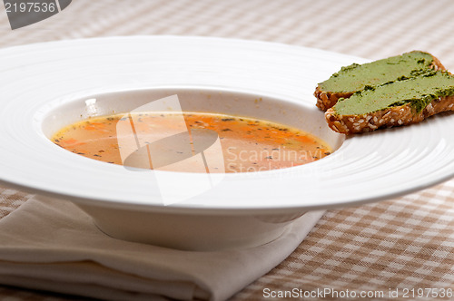 Image of Italian minestrone soup with pesto crostini on side