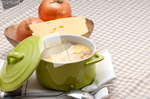Image of onion soup with melted cheese and bread on top