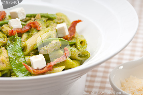 Image of Italian penne pasta with sundried tomato and basil