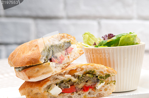 Image of ciabatta panini sandwichwith vegetable and feta