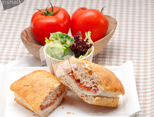 Image of ciabatta panini sandwich with parma ham and tomato