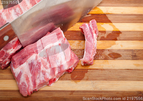 Image of chopping fresh pork ribs 
