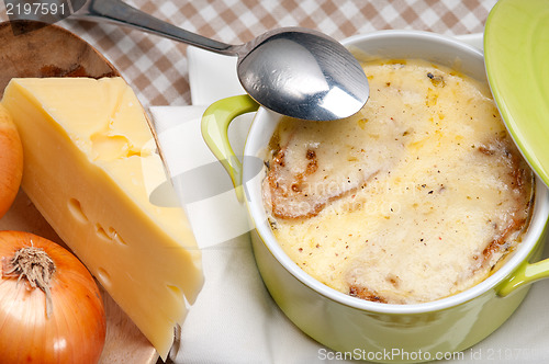 Image of onion soup with melted cheese and bread on top
