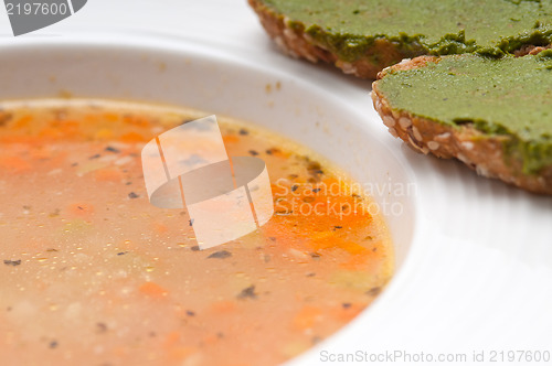 Image of Italian minestrone soup with pesto crostini on side