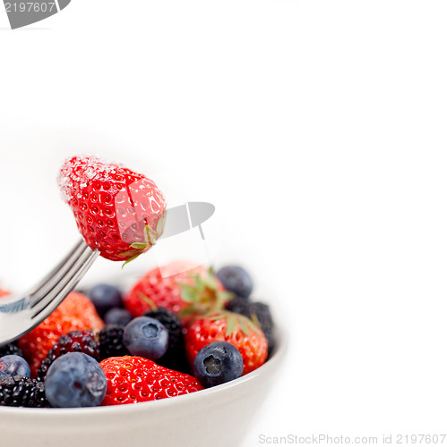 Image of srawberry on a fork isolated