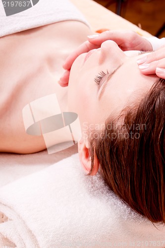 Image of young attractive smilig woman doing wellness spa