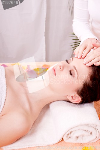 Image of young attractive smilig woman doing wellness spa