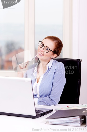 Image of smiling successful young business woman 