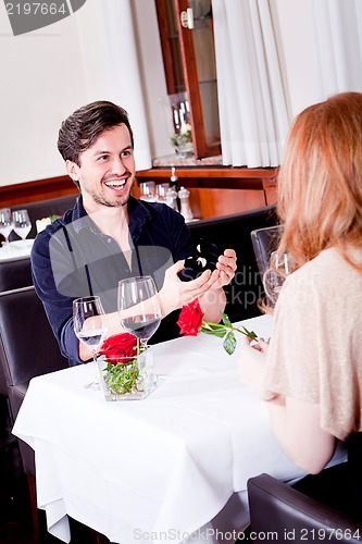 Image of happy couple in restaurant romantic date 