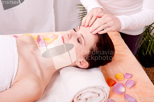 Image of young attractive smilig woman doing wellness spa