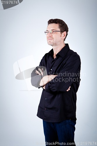 Image of attractive adult man with glasses and black shirt