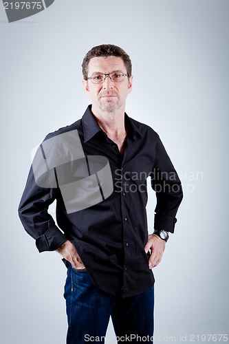 Image of attractive adult man with glasses and black shirt