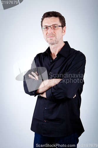 Image of attractive adult man with glasses and black shirt