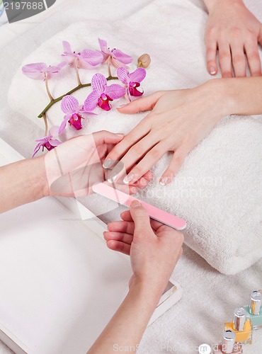 Image of manicure making in beauty spa salon 