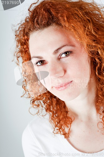 Image of attractive young redhead woman smiling portrait