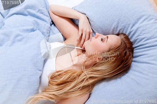 Image of sleeping beauty in blue bed