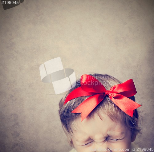 Image of Small baby with silver gift box