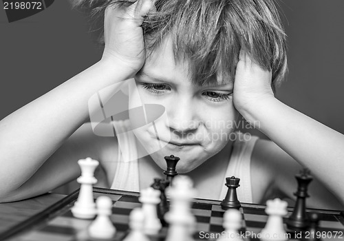 Image of Boy playing chess