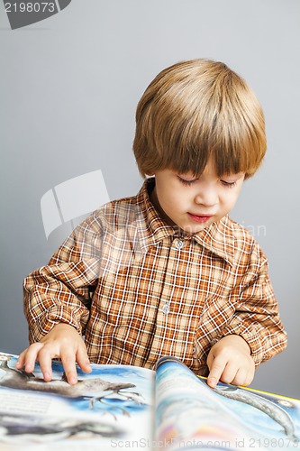 Image of child reading a book