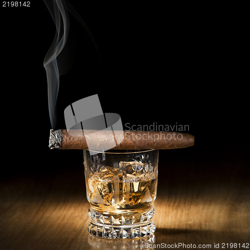Image of Whiskey and cigar