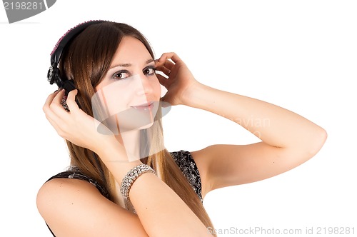 Image of young blonde woman listening music