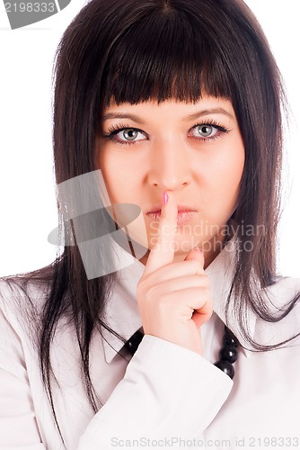 Image of Woman gesturing to silence