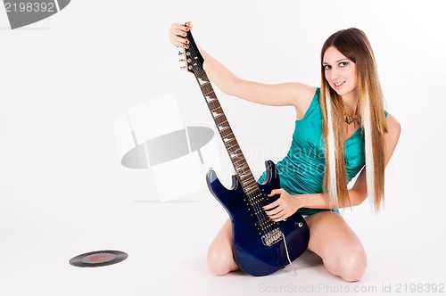 Image of Beautiful woman with guitar