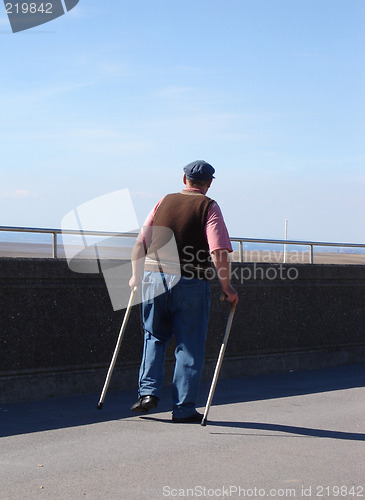 Image of Old man with walking sticks